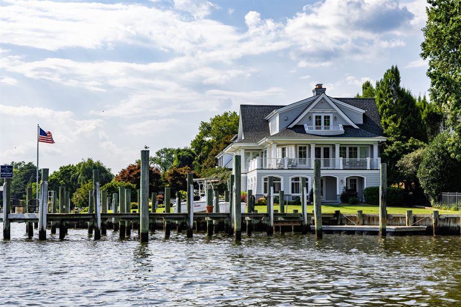 Waterfront home with a private dock and an American flag near Annapolis, Maryland